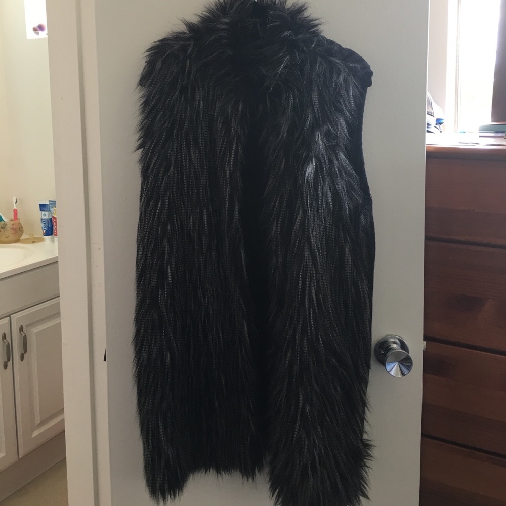 Black faux fur vest.