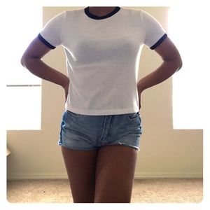 A white tee shirt with black lining