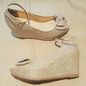 Never been worn sparkly Gold and Silver Bow Wedges