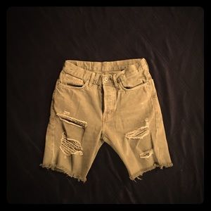 Tight ripped green denim shorts