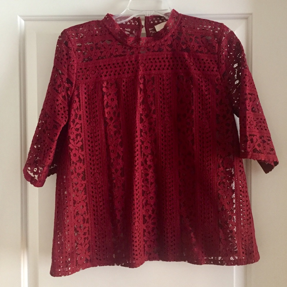 Maroon lacy top with exaggerated sleeve