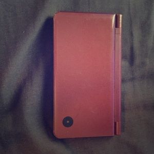 A ds ixl with 4 games and a charger