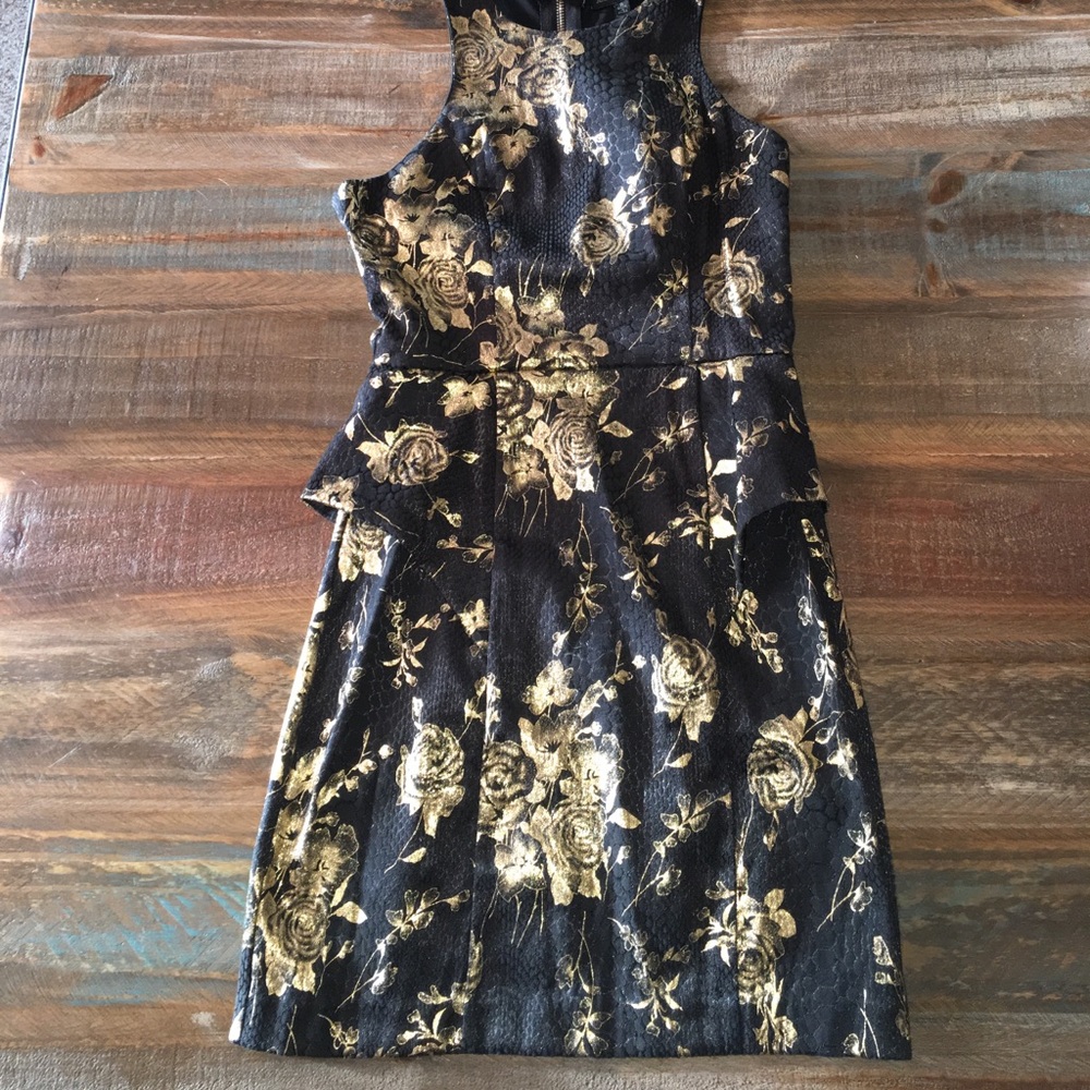 Boutique peplum dress with gold detail. Size small