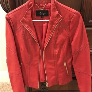 Red blazer with gold zipper trim