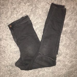 Distressed black denim jeans