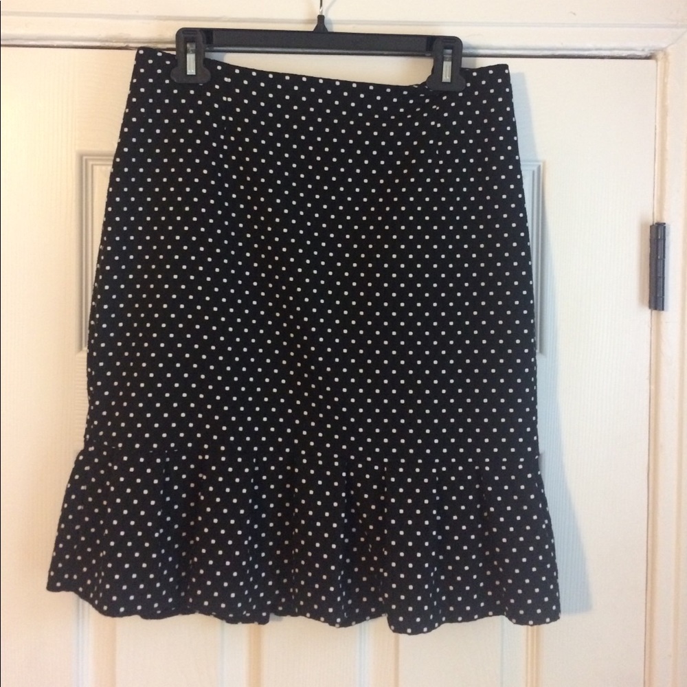 Black, polka dot skirt with ruffled bottom hem.