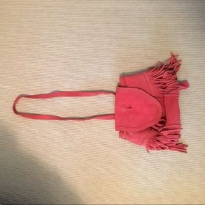 A super cute fringe backpack and purse