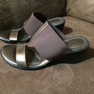 Gold wedge dress sandals.