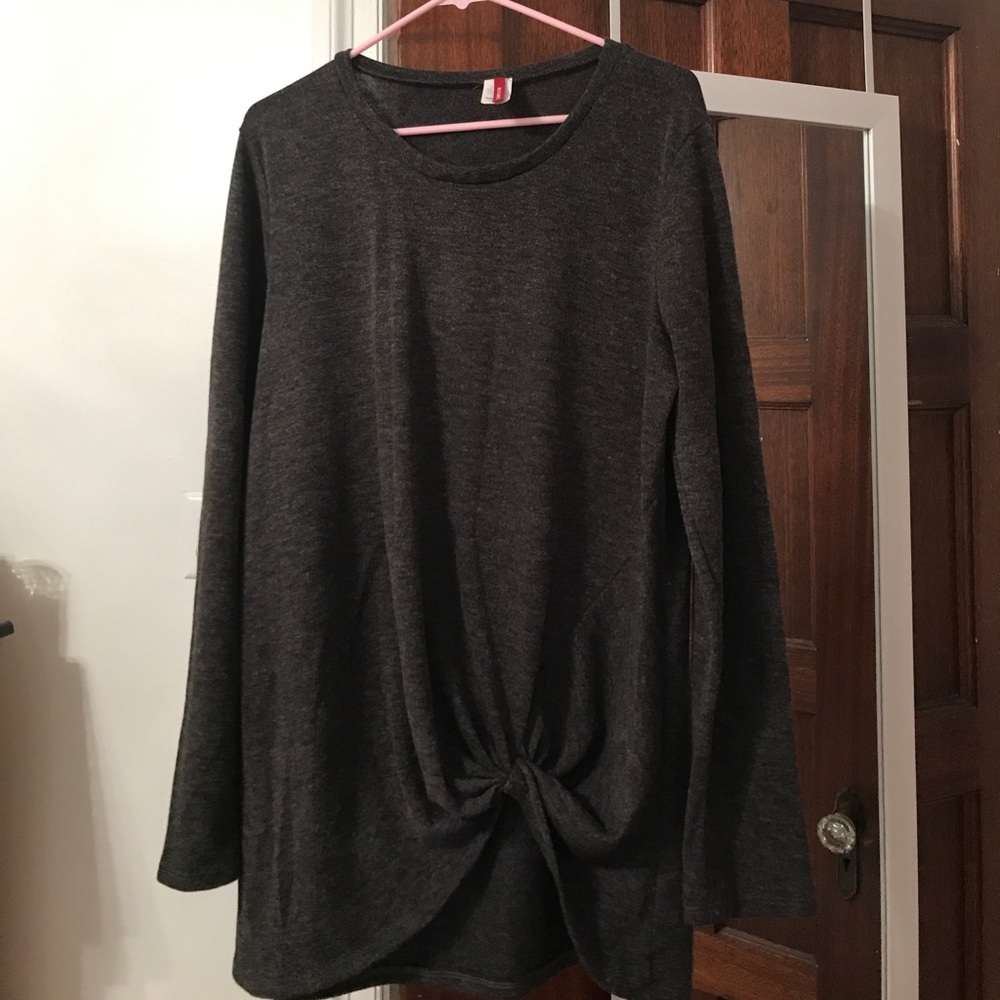 Charcoal sweater with knot.