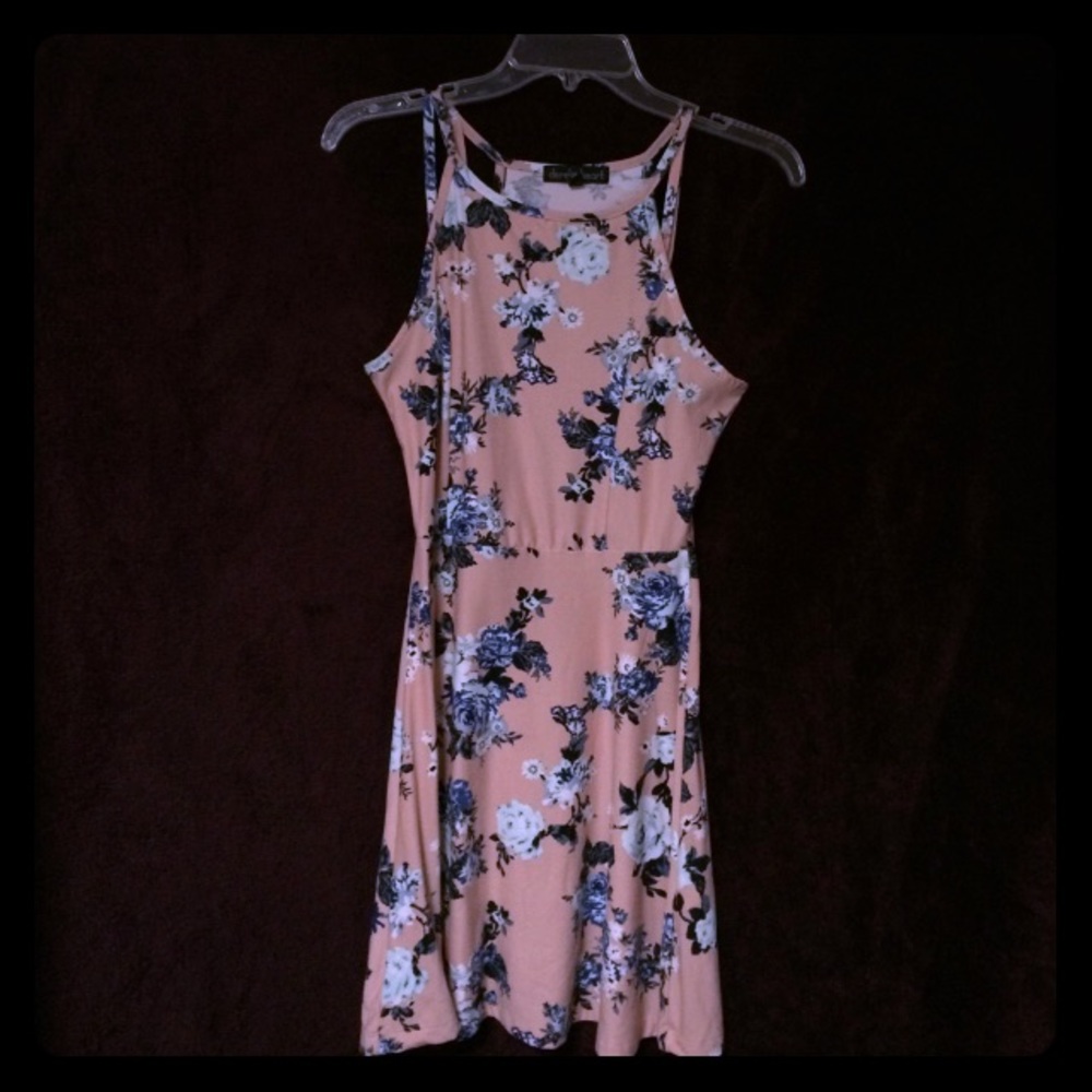 Soft pink or salmon colored floral dress.