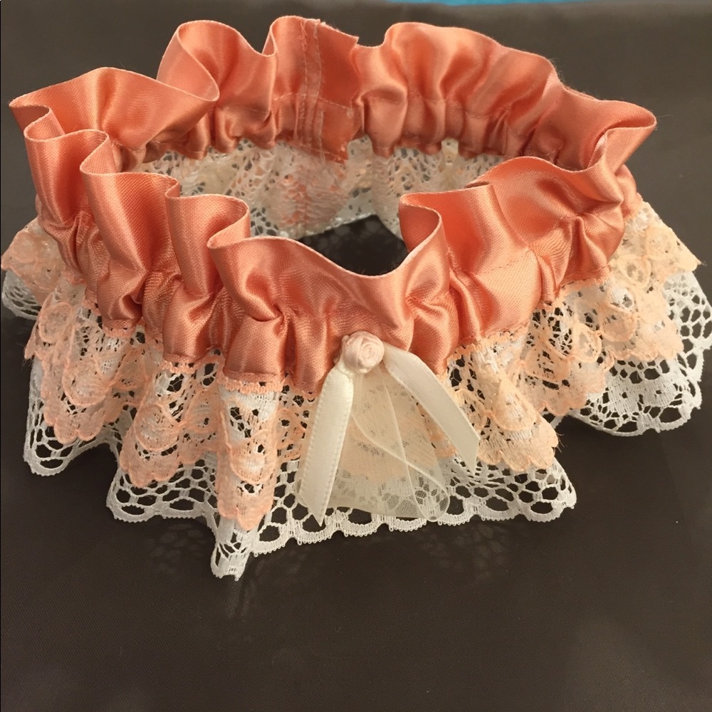 Handmade bridal garter in deep peach and ivory.