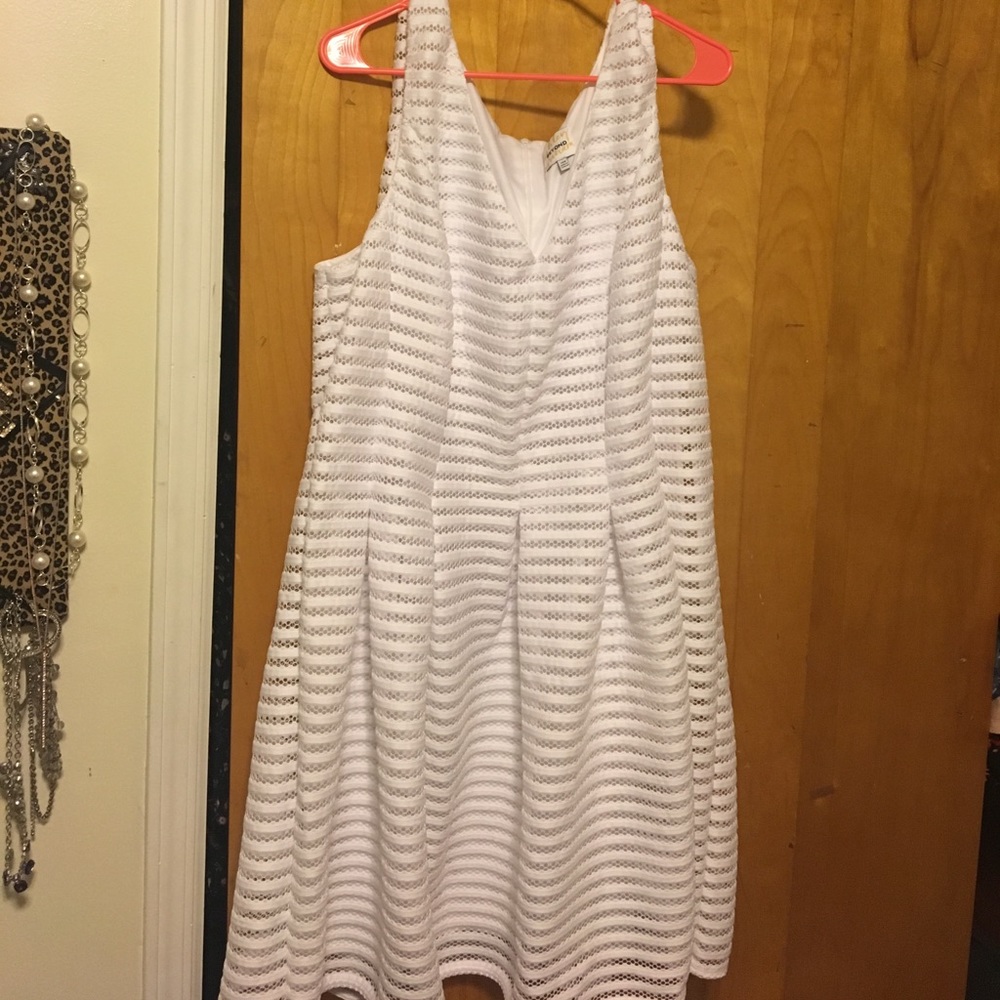 Ashley Graham white pleated dress