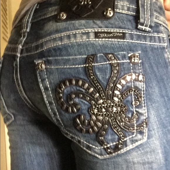 jeans with fleur de lis on pocket