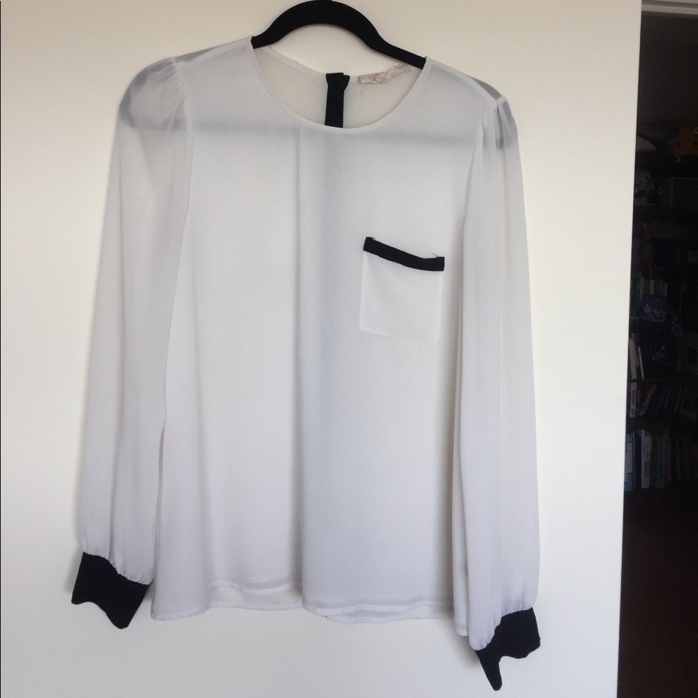 Sheer white top with black trim wrist
