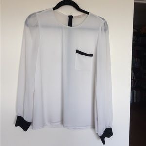 Sheer white top with black trim wrist