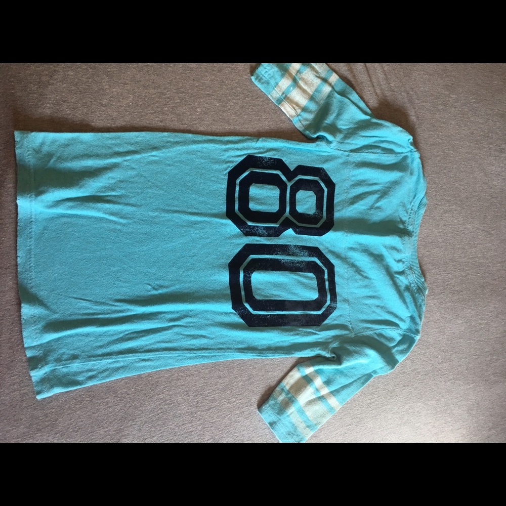 Pink tshirt. Size xsmall. Light blue color