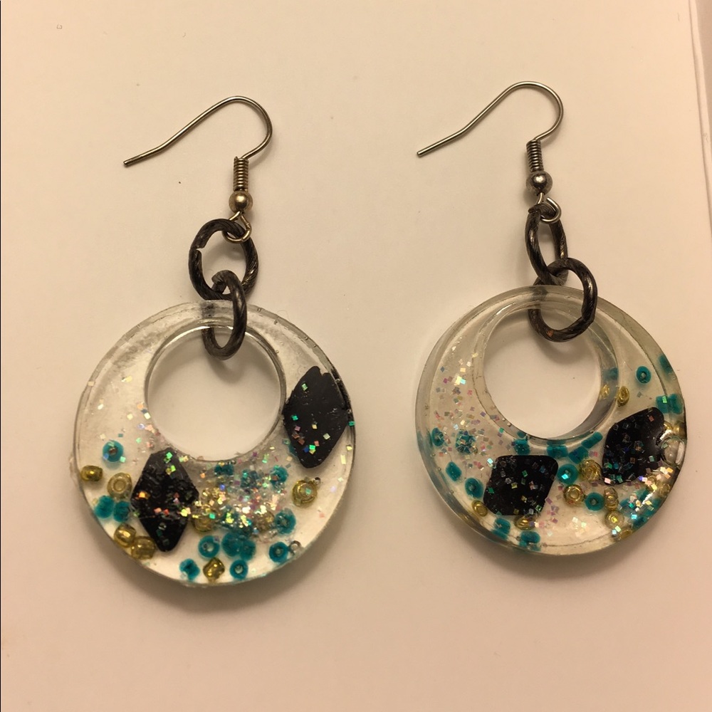 Handcrafted crescent hoop earrings.
