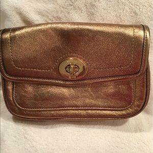 Gold coach clutch bag