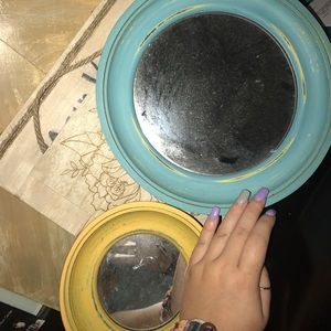 Two distressed mirrors