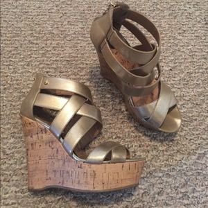 Gold wedged heels by Guess