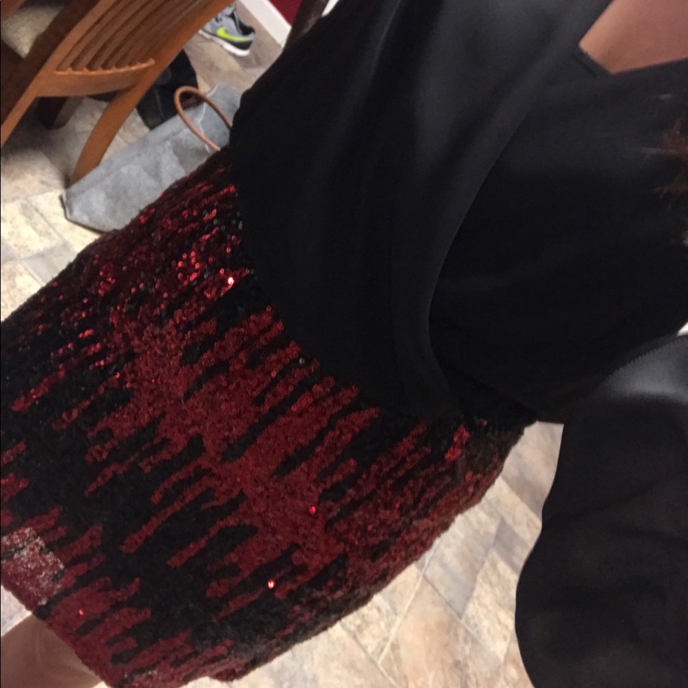 Long sleeve dress with black top & sequin bottom.