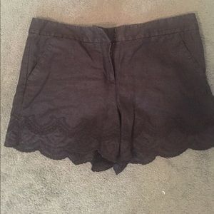 Black cloth and lace trimmed shorts