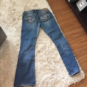 Distressed silver boot cut jeans