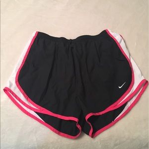 Black and pink Nike Tempos