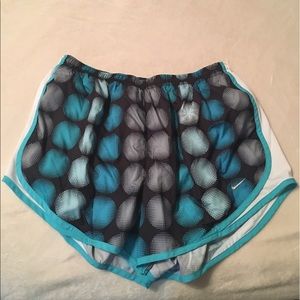 Blue and black Nike Tempos