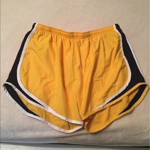 Yellow Nike tempo shorts