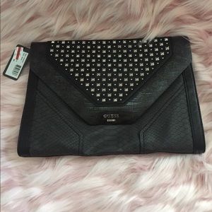 Guess large black clutch with silver studs.