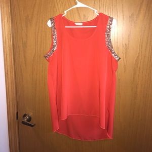 Orange tank top.