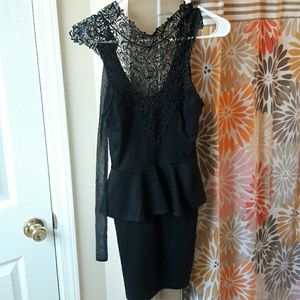Black dress, lace at the top. Ties around the neck