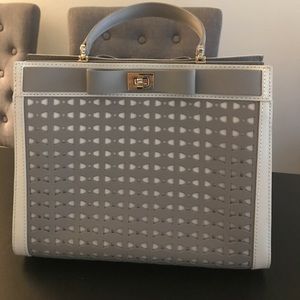 Light gray Kate Spade bow top handle satchel