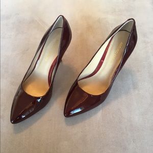 Dark red patent pumps
