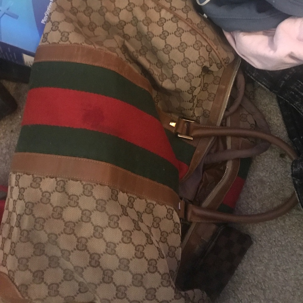 Gucci duffle bag and luv pouch