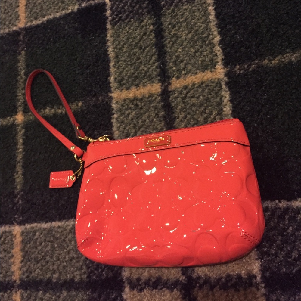 Coral coach wristlet