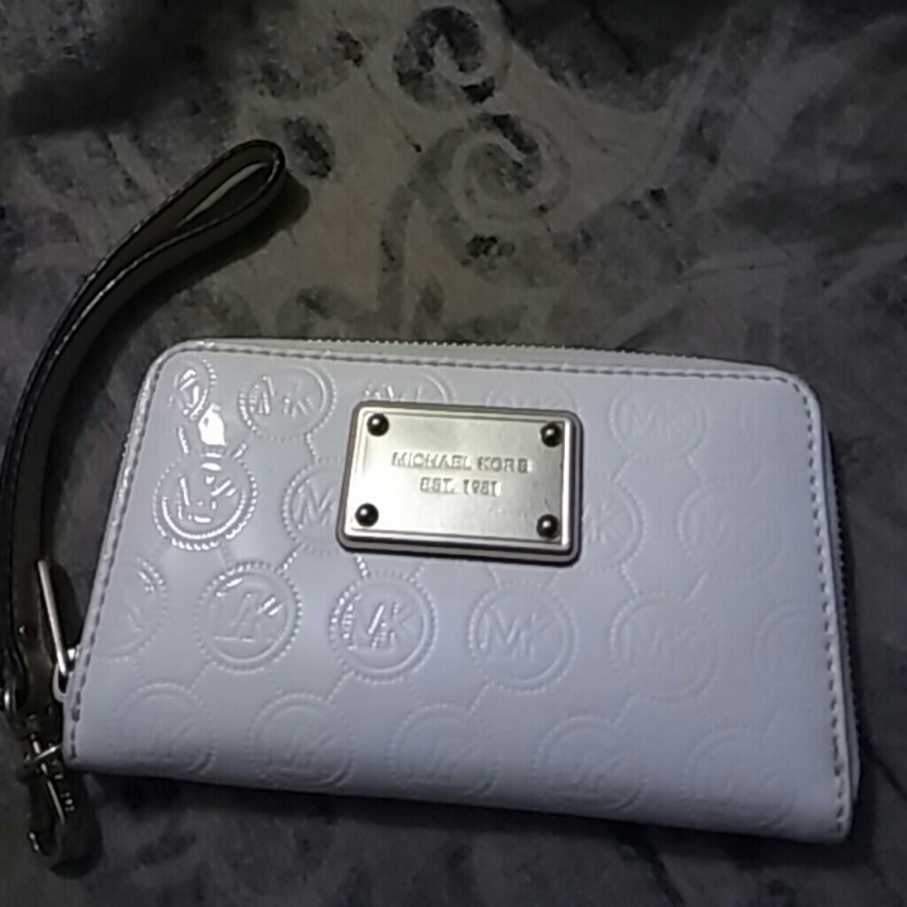SOLD   White Michael Kors wristlet.