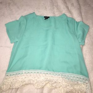 It's a teal crop top with a lacy bottom!
