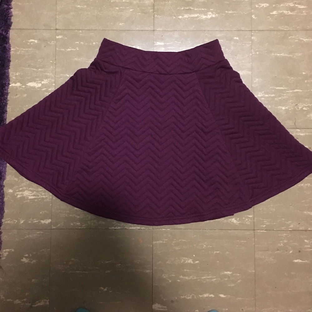 A quilted, purple skirt with back zipper
