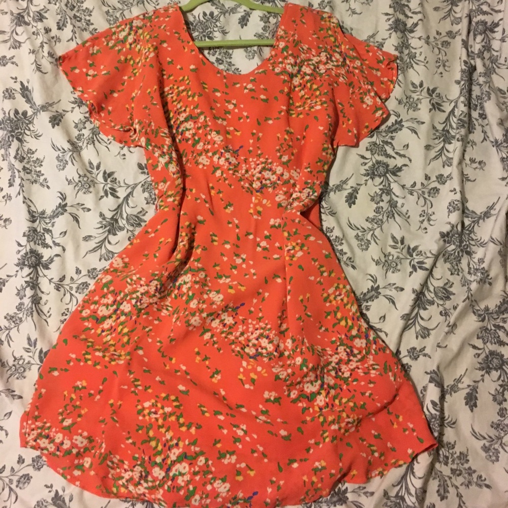 Orange dress with white & yellow flowered pattern