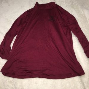 A maroon Long sleeve shirt that says "not sorry"!!