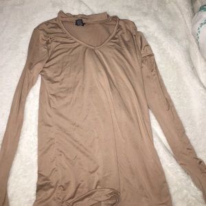 A tan long sleeve shirt that shows chest!