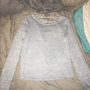 Long sleeve shirt with criss cross straps in back