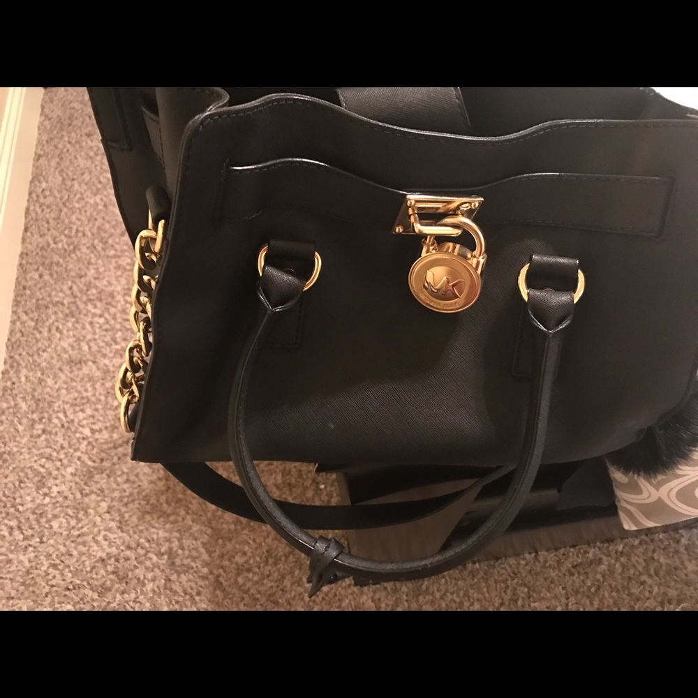 Authentic Micheal Kors bag with puff ball