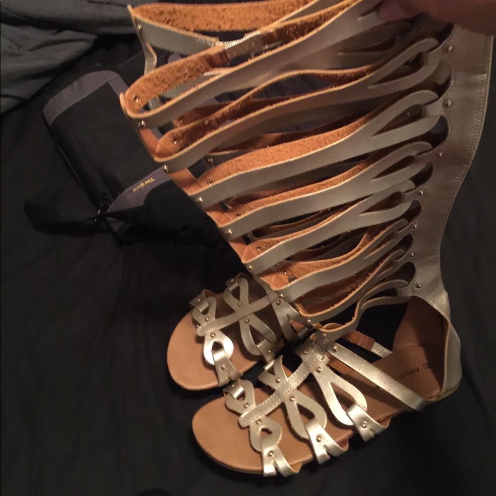 Gold Torrid tall gladiator sandals with zip back.