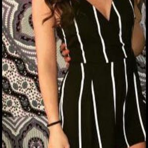 Black romper with white stripes