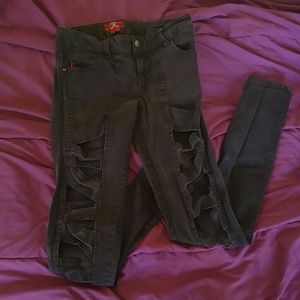 Royal Bones jeans with cutouts