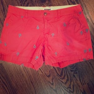 VGUC orangish pink shorts with teal anchors.