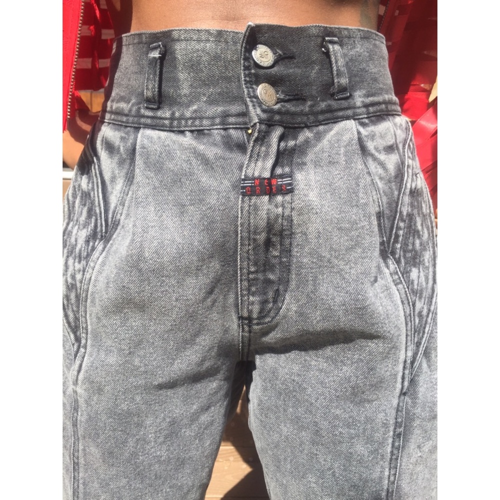 Vintage high waisted charcoal colored denim jeans.